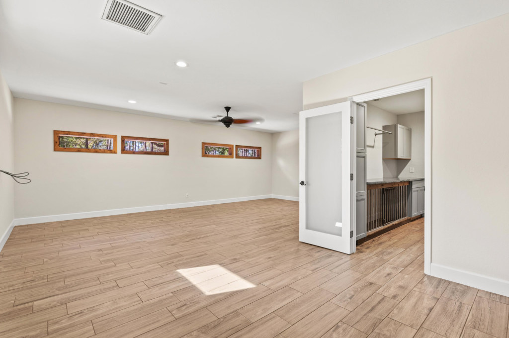 Freshly painted interior of a Sarasota home staged for sale — warm neutral walls, white trim, and open floor plan showcasing move-in ready condition for prospective buyers.